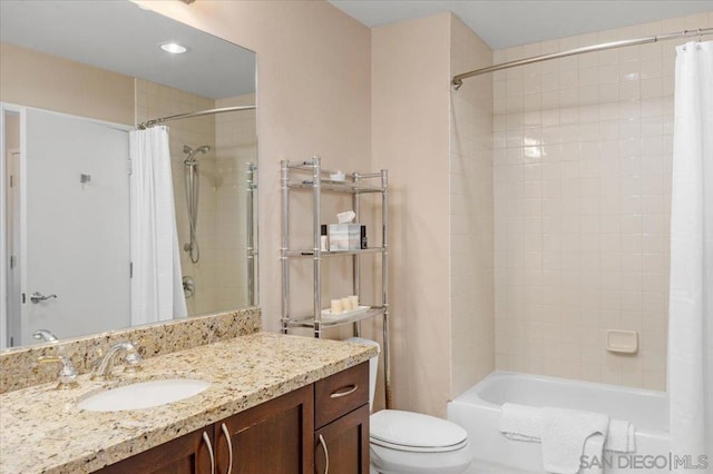 full bathroom with toilet, vanity, and shower / bathtub combination with curtain