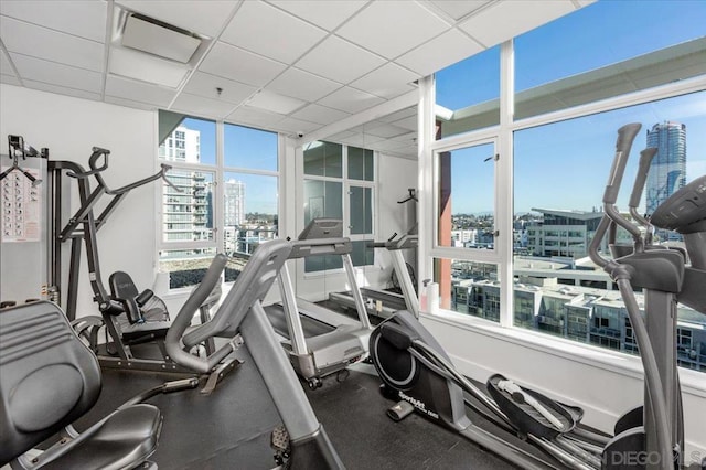 workout area featuring a drop ceiling