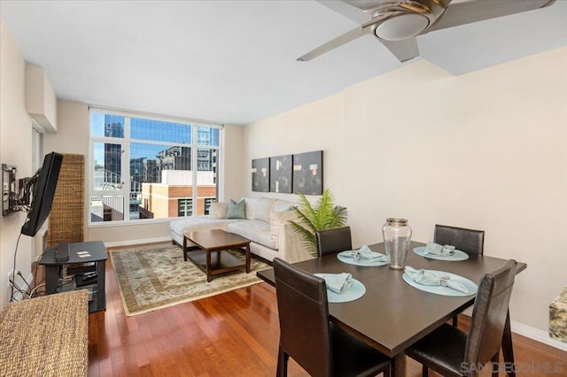 dining space featuring ceiling fan and wood-type flooring