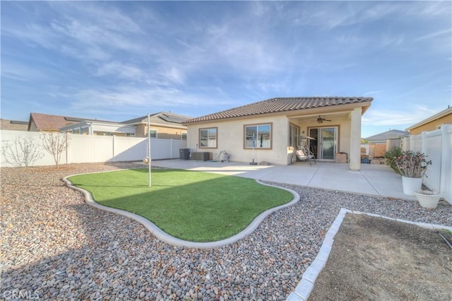 back of property with a patio area and ceiling fan