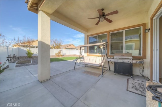 view of patio / terrace featuring ceiling fan and a grill