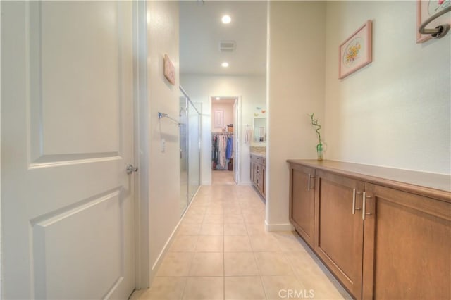 hallway featuring light tile patterned flooring