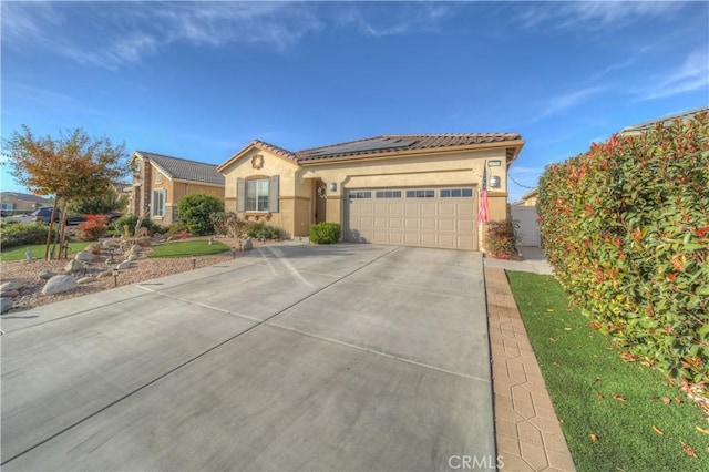 mediterranean / spanish-style home featuring a garage