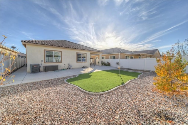 rear view of property with a patio and central air condition unit