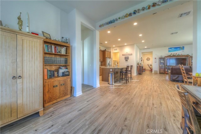 living room with light hardwood / wood-style flooring