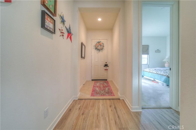 hall with light hardwood / wood-style floors