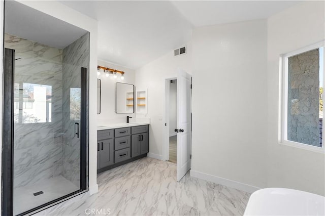 bathroom featuring vaulted ceiling, a shower with door, and vanity