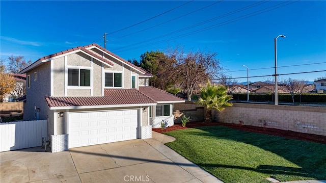 view of front of home with a front lawn and a garage