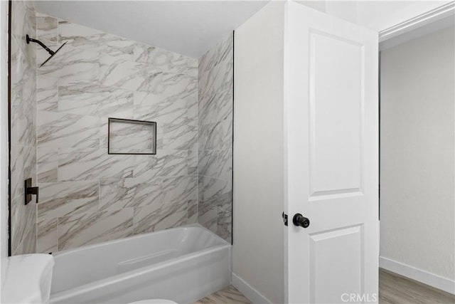 bathroom with tiled shower / bath combo