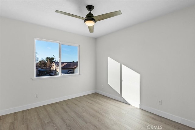 unfurnished room with ceiling fan and light hardwood / wood-style flooring