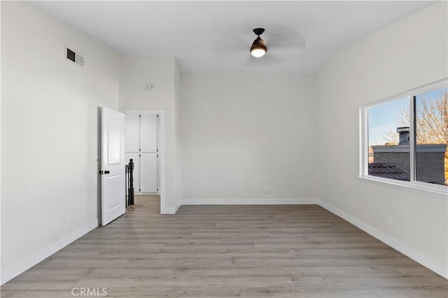 spare room with ceiling fan and light hardwood / wood-style floors