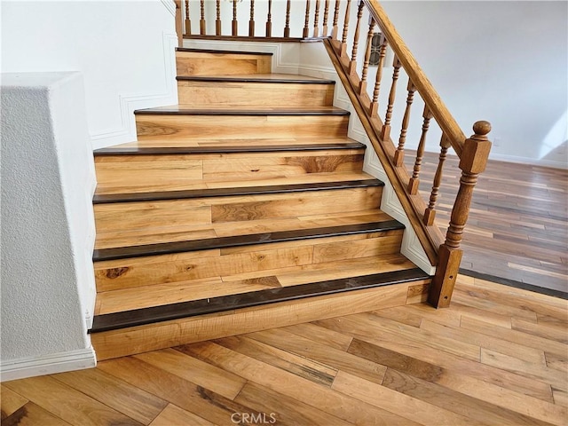 staircase featuring hardwood / wood-style floors