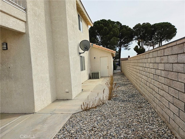 view of property exterior with central air condition unit