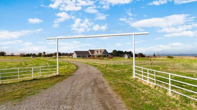 surrounding community featuring a rural view and a yard