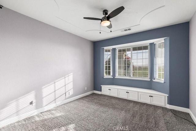 unfurnished room featuring carpet floors and ceiling fan