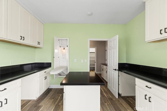 kitchen with white cabinetry and a center island