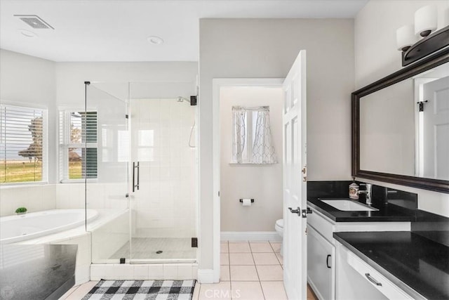 full bathroom with toilet, tile patterned flooring, shower with separate bathtub, and vanity