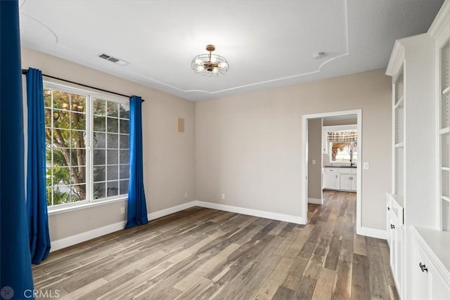 empty room with wood-type flooring