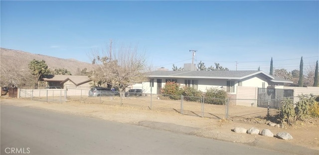 view of front of property with a mountain view