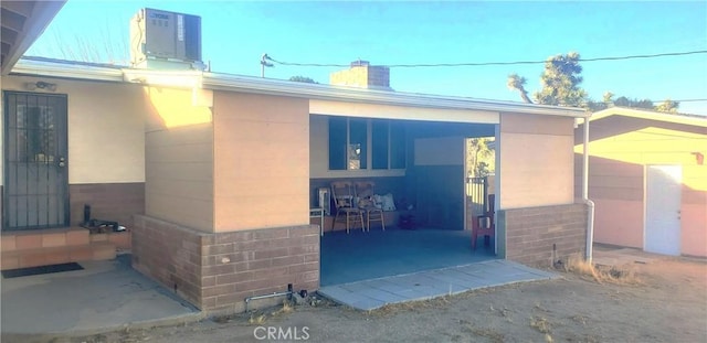 doorway to property with cooling unit