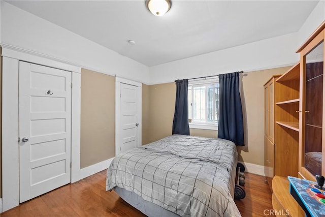 bedroom with hardwood / wood-style floors