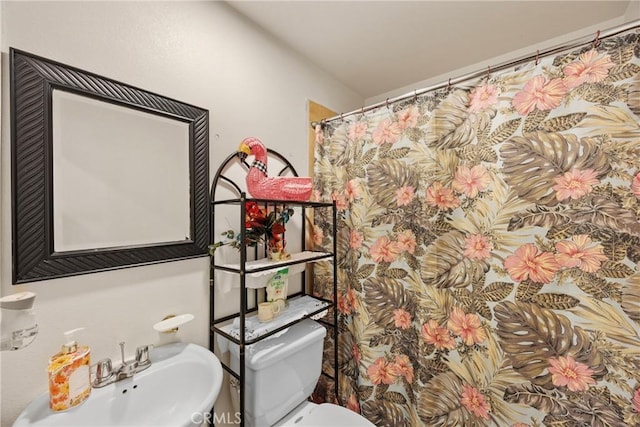 bathroom featuring sink and toilet