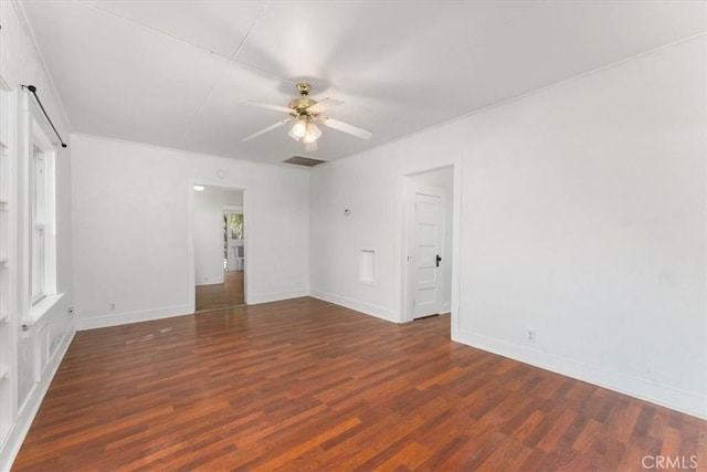 unfurnished room featuring ceiling fan and dark hardwood / wood-style flooring