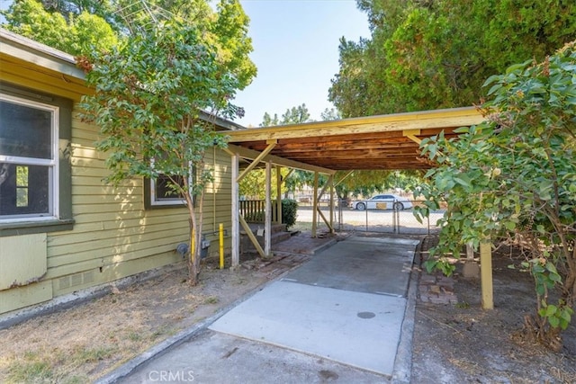 view of vehicle parking featuring a carport