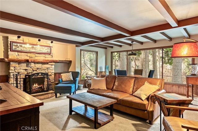 801 Kuffel Canyon Rd, Lake Arrowhead, CA 92385 - living room with beam ceiling, a stone fireplace, and light carpet