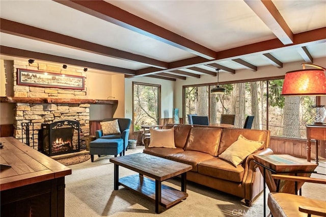 801 Kuffel Canyon Rd, Lake Arrowhead, CA 92385 - living room with beam ceiling, a stone fireplace, and light carpet