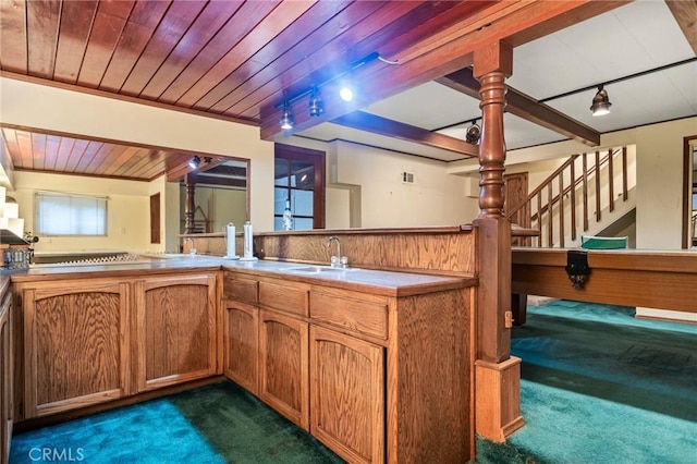 801 Kuffel Canyon Rd, Lake Arrowhead, CA 92385 - kitchen featuring dark carpet, a sink, rail lighting, wood ceiling, and brown cabinetry