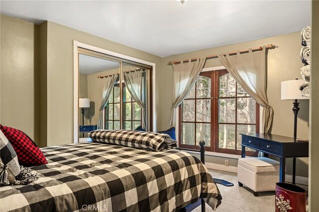 801 Kuffel Canyon Rd, Lake Arrowhead, CA 92385 - carpeted bedroom featuring multiple windows