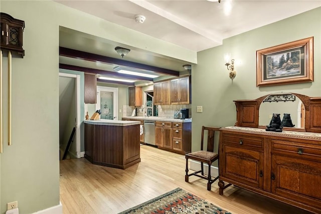 801 Kuffel Canyon Rd, Lake Arrowhead, CA 92385 - kitchen featuring dishwasher, light wood finished floors, light countertops, tasteful backsplash, and a peninsula