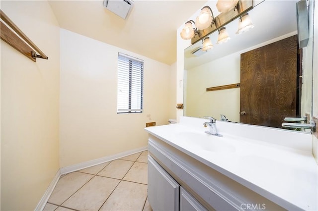 bathroom with tile patterned floors and vanity