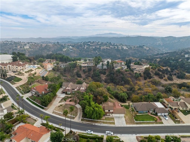 drone / aerial view featuring a mountain view