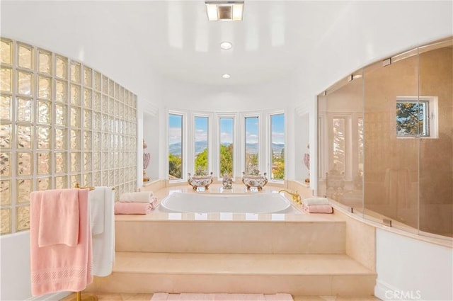 bathroom with tiled tub