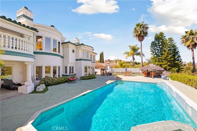 view of pool featuring a patio