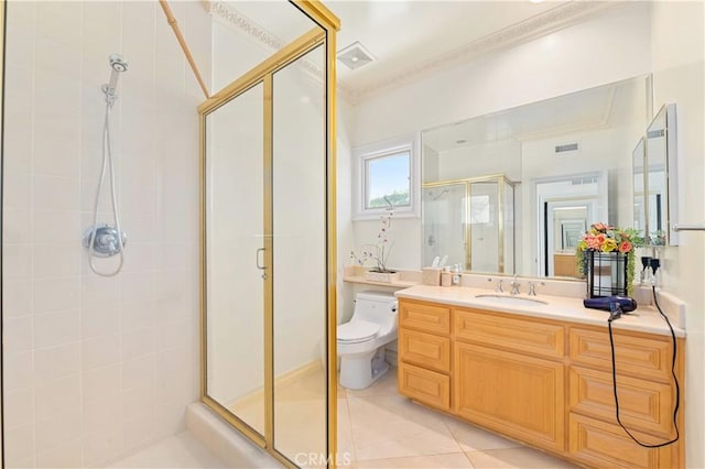 bathroom with a shower with door, toilet, tile patterned floors, and vanity