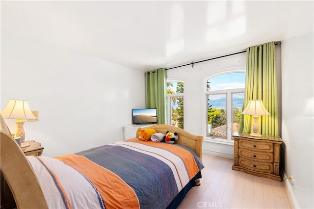 bedroom featuring light wood-type flooring