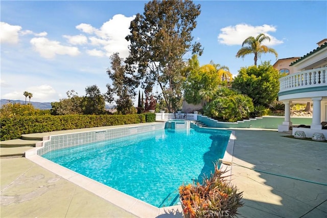 view of swimming pool featuring a patio