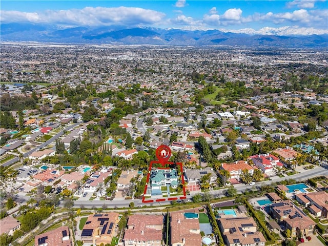 drone / aerial view featuring a mountain view