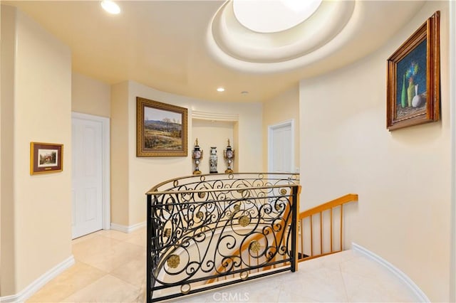 hallway with tile patterned floors