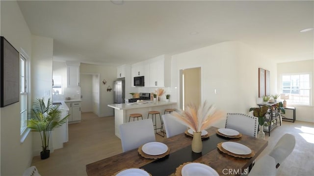 dining area featuring light hardwood / wood-style floors