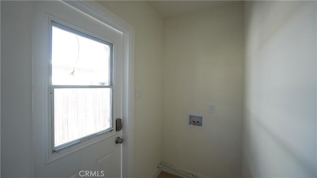 washroom with a wealth of natural light and hookup for a washing machine