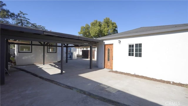 view of patio featuring a carport