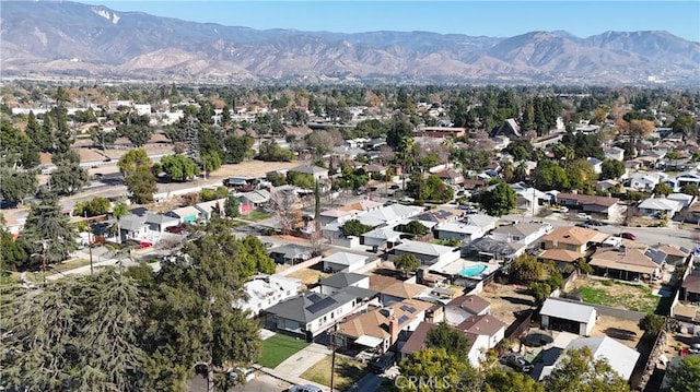 birds eye view of property with a mountain view