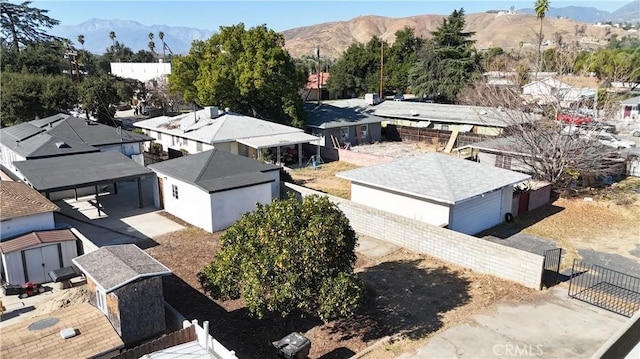 birds eye view of property featuring a mountain view