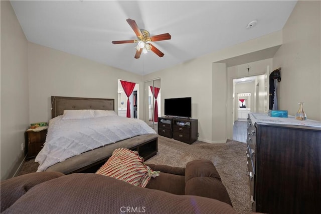 bedroom featuring ceiling fan, a closet, and carpet flooring