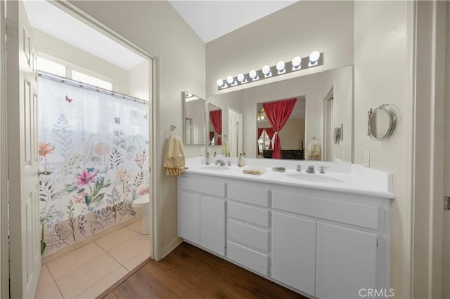 full bathroom with toilet, tile patterned flooring, shower / bath combo, and vanity