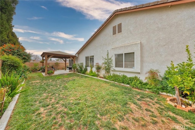 view of yard featuring a gazebo and a patio